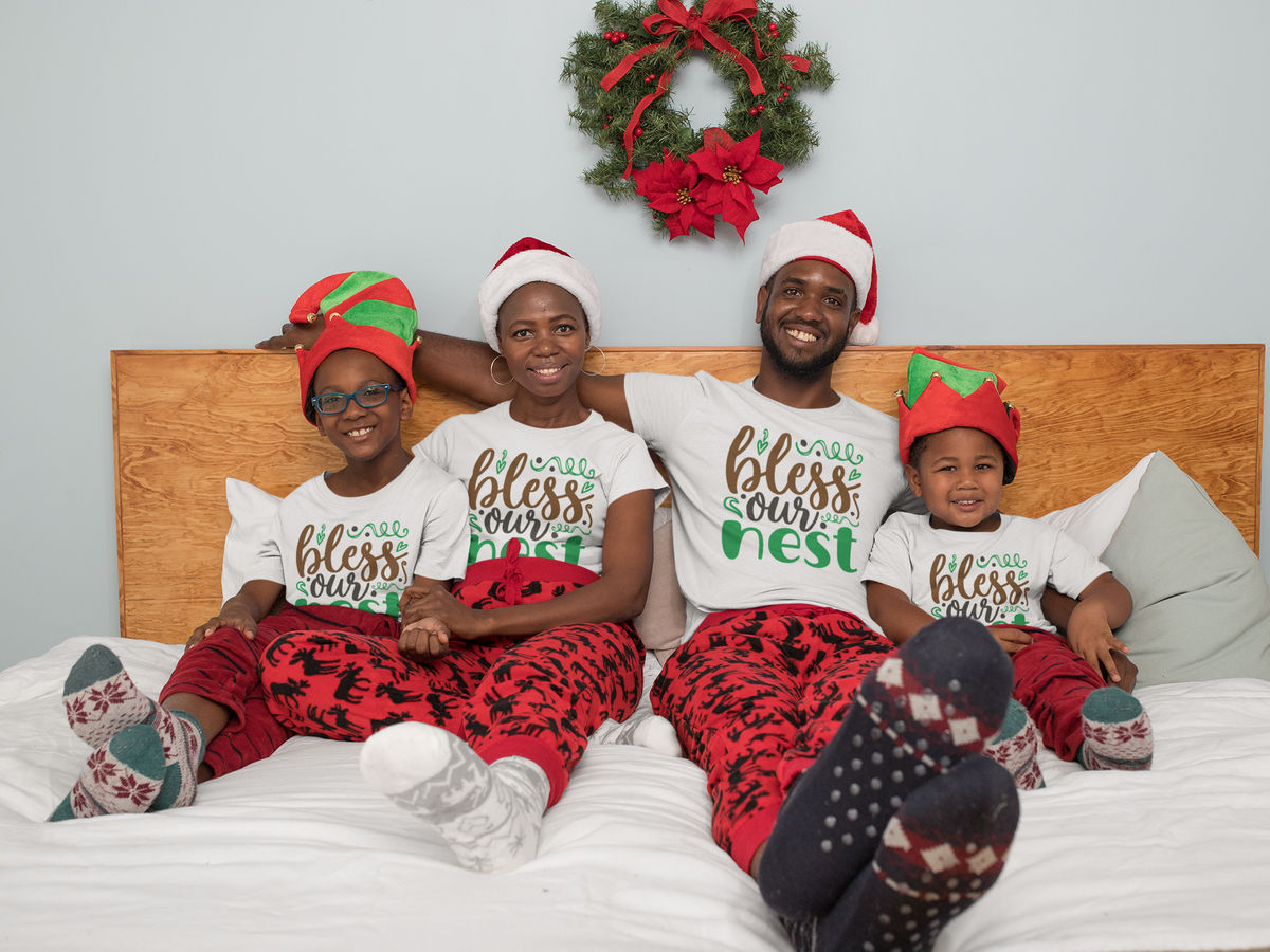 Matching family wearing Bless Our Nest Christmas shirts