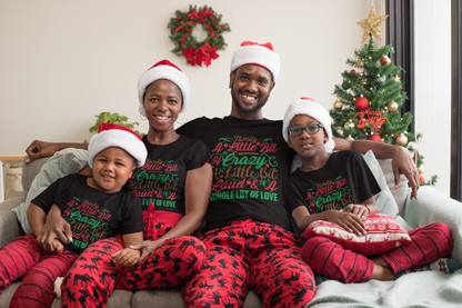 Family of four in matching black Family: A Little Bit of Crazy Christmas tees