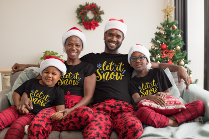 Family of four in matching black Let It Snow Christmas tees