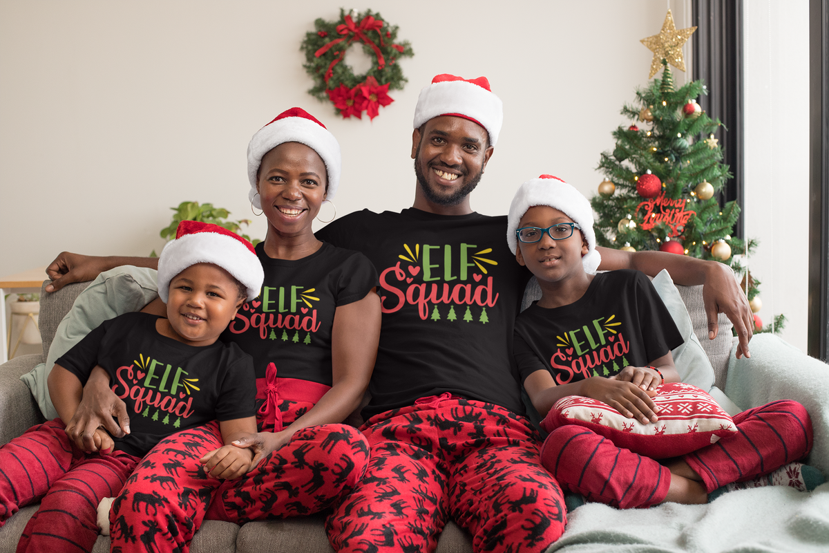 Family of four in matching black Elf Squad Christmas tees