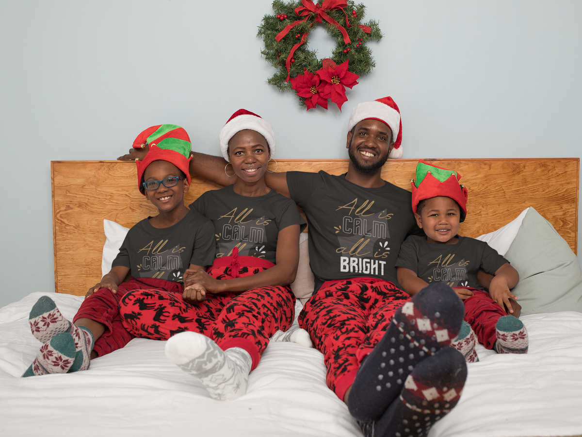 Matching family wearing All Is Calm, All Is Bright Christmas shirts