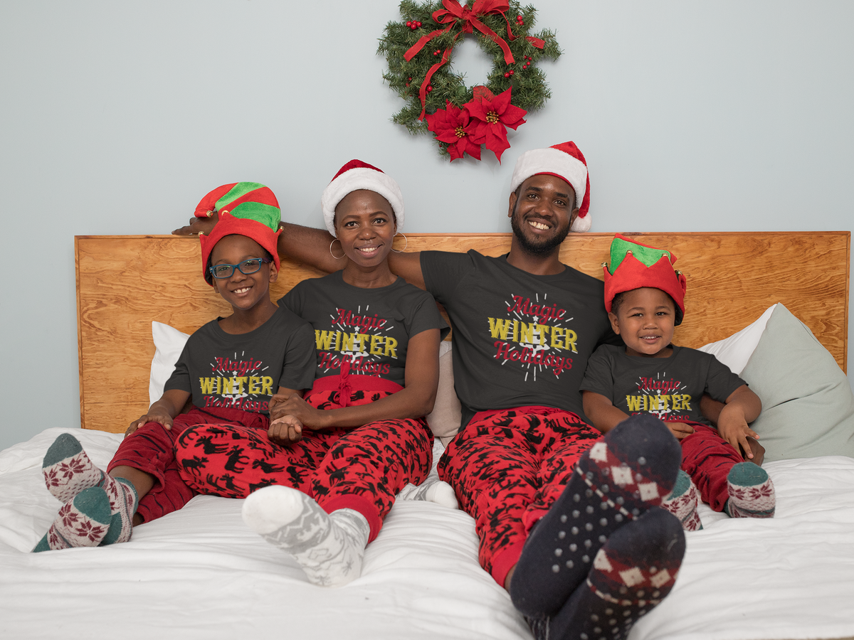 Matching family wearing Magic Winter Holidays Christmas shirts