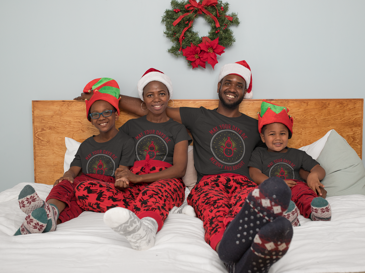 Matching family wearing May Your Days Be Merry and Bright Christmas shirts