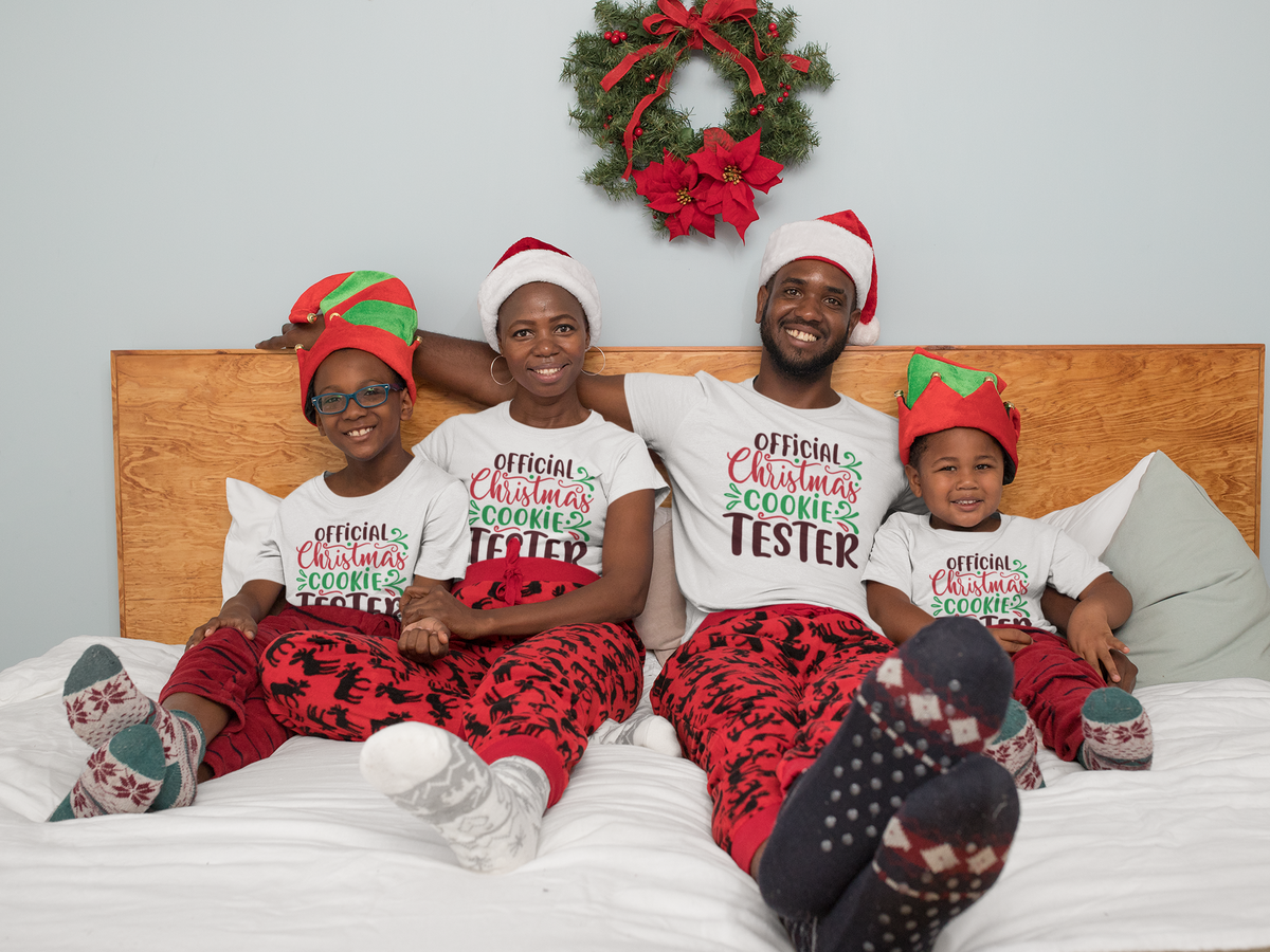 Matching family wearing Official Christmas Cookie Tester shirts