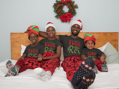 Matching family wearing Tree Rex Christmas shirts