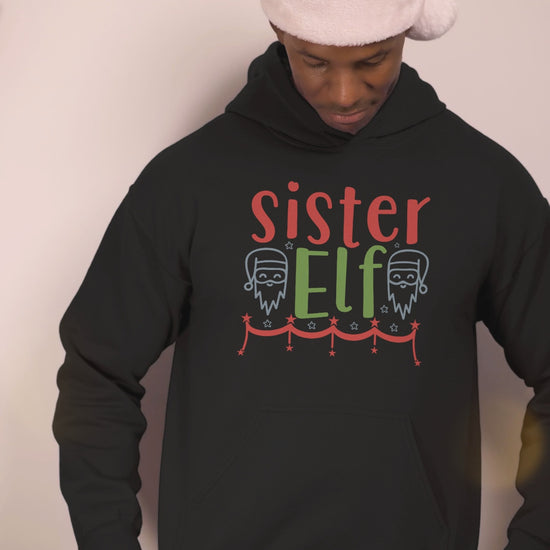 Video of a man wearing the Sister Elf black Christmas hoodie