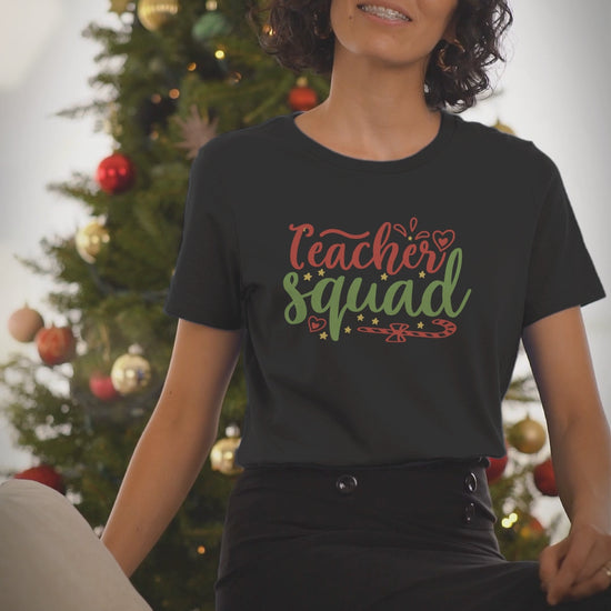 Video of a woman wearing the Teacher Squad black Christmas t-shirt