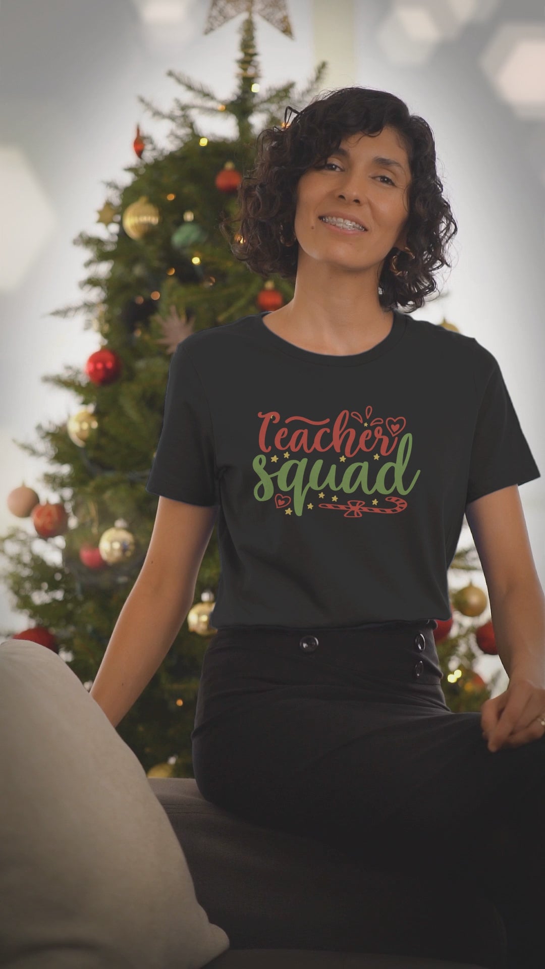 Video of a woman wearing the Teacher Squad black Christmas t-shirt