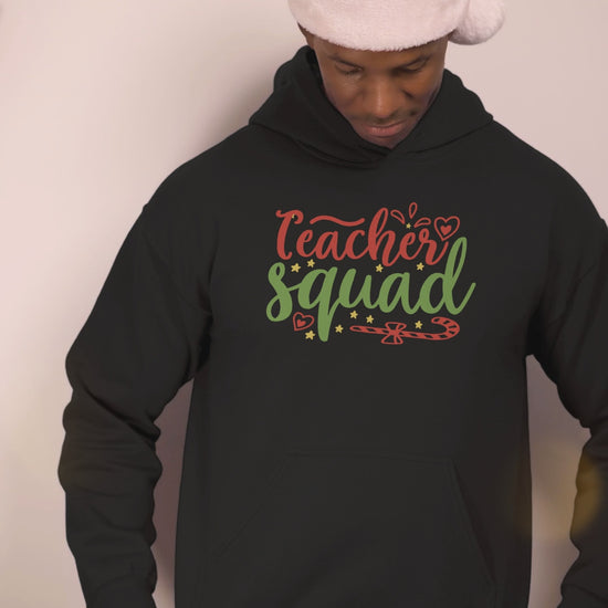 Video of a man wearing the Teacher Squad black Christmas hoodie